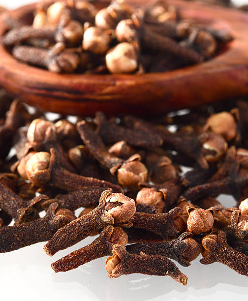 istock clove in spoon isolated on a white background 498380100