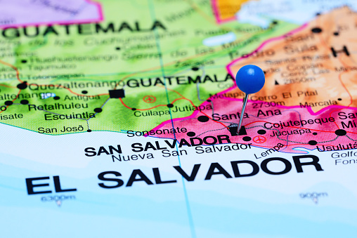 Photo of pinned San Salvador on a map of North America. May be used as illustration for traveling theme.