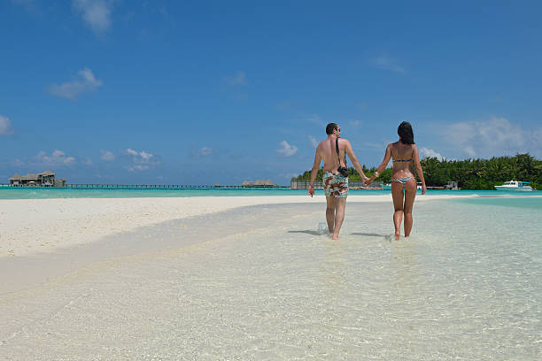 istock happy young couple have fun on beach 498380916