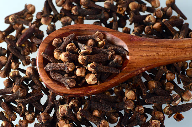 istock clove in spoon isolated on a white background 498381620