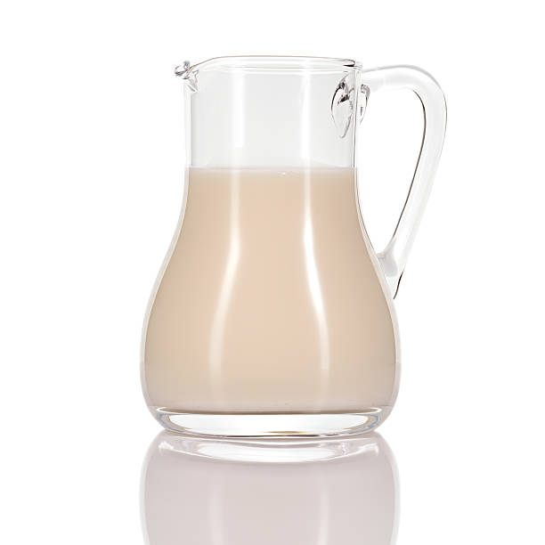 istock Almond milk in jug on white background. 498386053