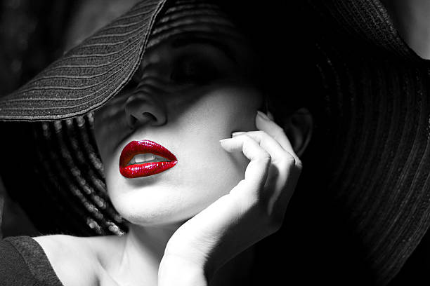 istock Mysterious woman in black hat. Red lips 498386155