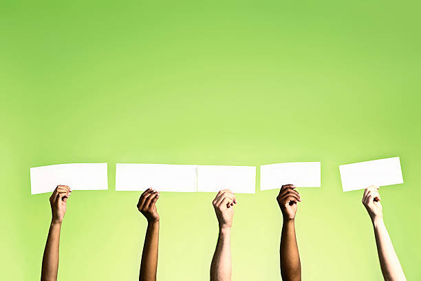 istock Five hands hold up blank signs for your message 498386737