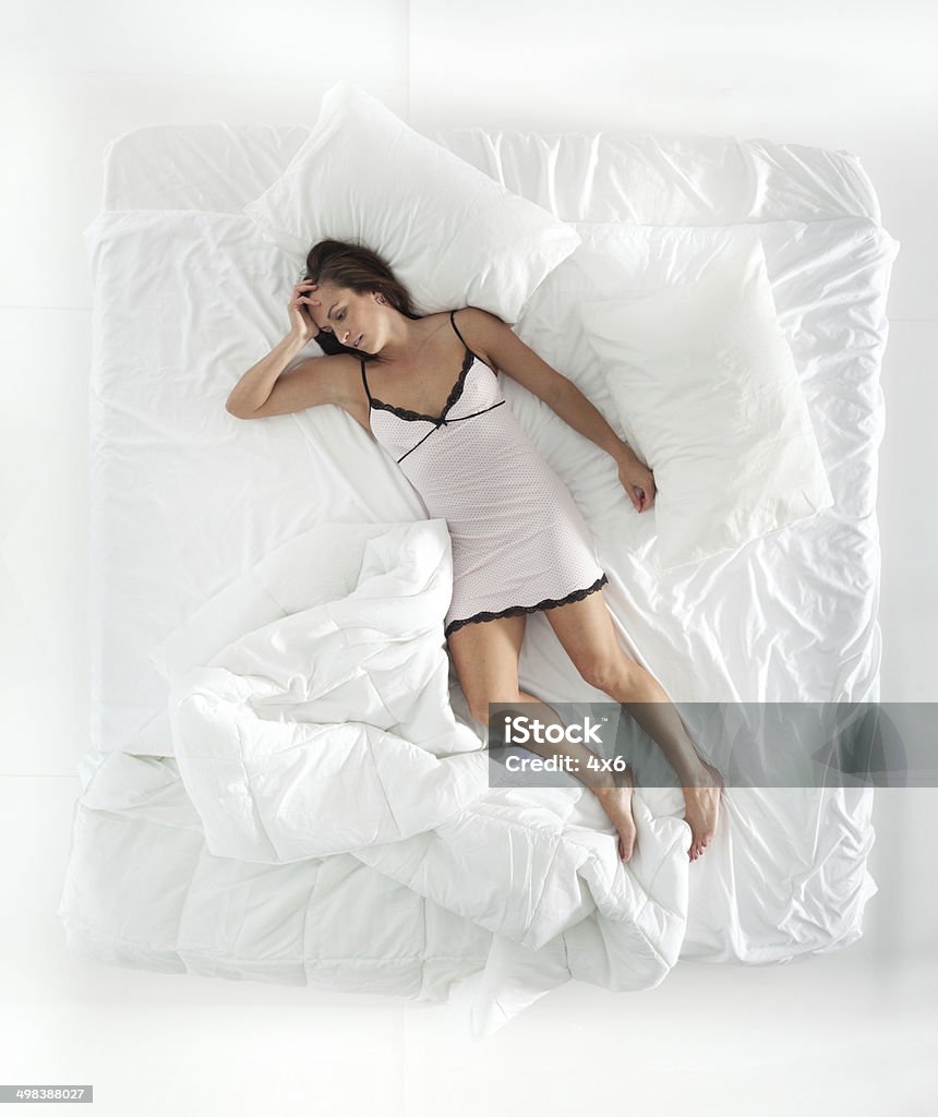Above view of woman sleeping Above view of woman sleepinghttp://www.twodozendesign.info/i/1.png Sleeping Stock Photo