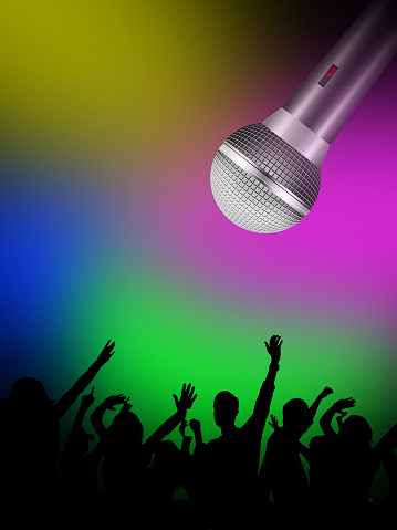 Happy and cheerful crowd under colored lights dance, sing out your joy, dance out your happiness