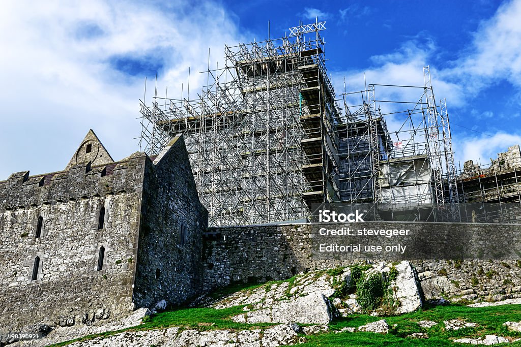 Restoring the Rock of Cashel in Tipperary, Ireland Cashel, Ireland - October 19, 2013: Restoration at the Rock of Cashel in Tipperary, Ireland. Scaffolding viewed from outside of the castle. No people. Castle Stock Photo