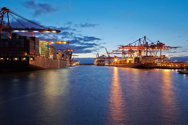 istock Container vessel at terminal in harbor in the evening 498390969