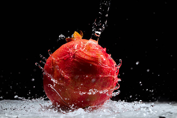 Pomegranate splashing water