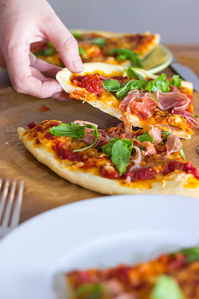 istock Grabbing a slice of Pizza 498397024