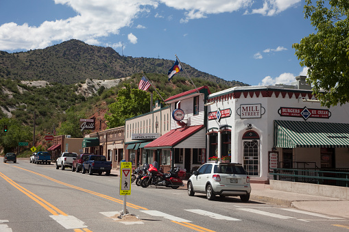 Morrison, Colorado, USA - June 13, 2014: Popular shops and restaurants remain in old historic brick buildings which line the main street in downtown Morrison.