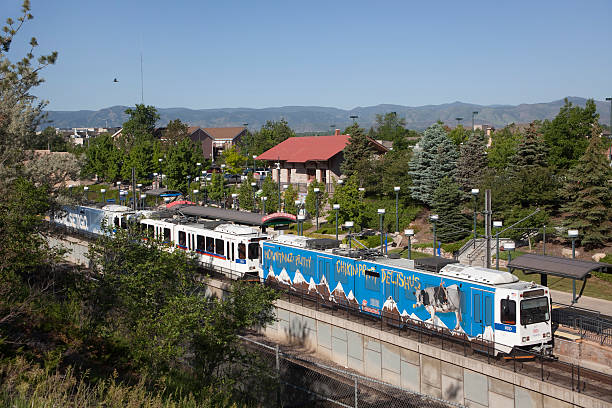 Northbound light rail train Littleton Station Colorado Littleton, Colorado, USA - June 13, 2014: A northbound RTD light rail train with colorful advertising on the sides rolls up to the Littleton Station. littleton colorado stock pictures, royalty-free photos & images