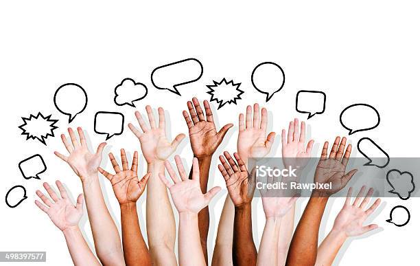 Multiethnic Peoples Hands Raised With Speech Bubble Stock Photo - Download Image Now