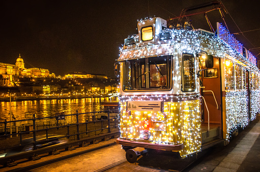Tram in Budapest decorated with lights for the holiday season.