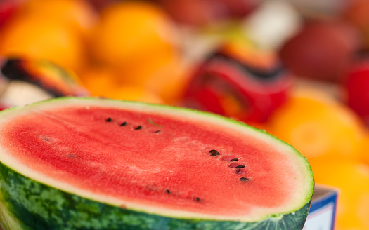 Pulp of a colorful watermelon in fruit market stall in Venice