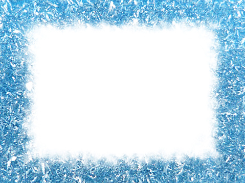 Frost crystals on blue make up a edge frame with white center.
