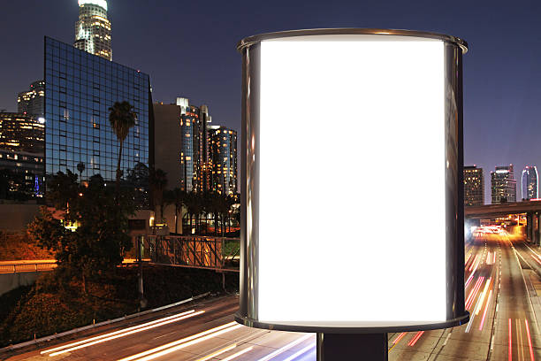 istock Blank billboard on night street road, mock up 498399046