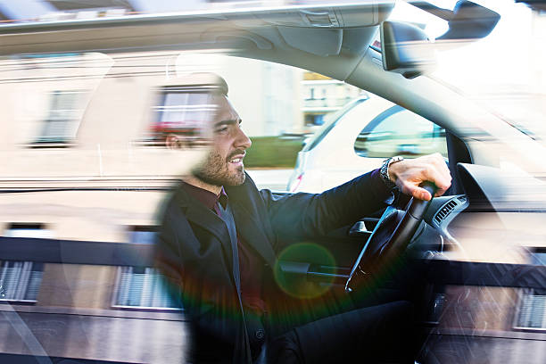 istock Businessman driving car 498399756