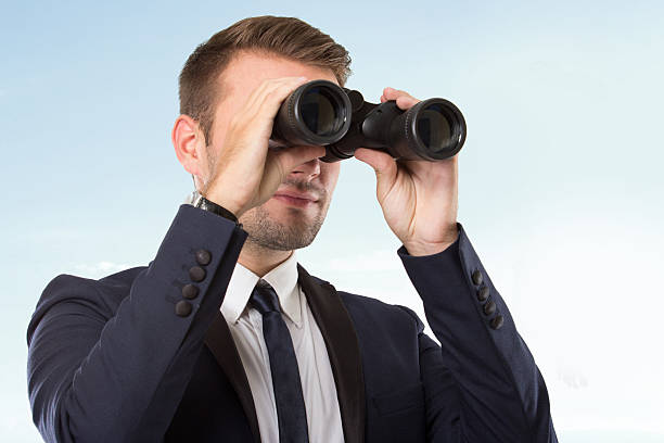 istock Young businessman with a binocular 498399920
