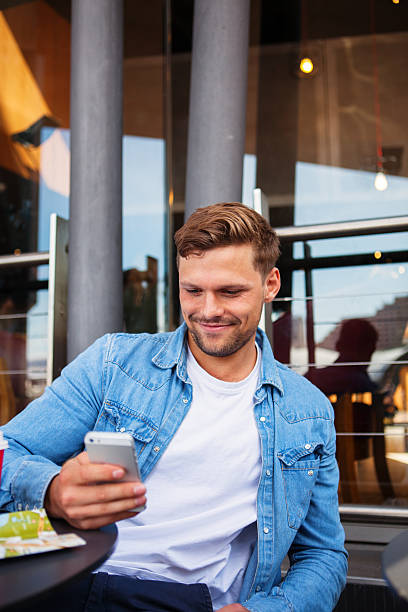 istock Young adult at a coffee house 498401124
