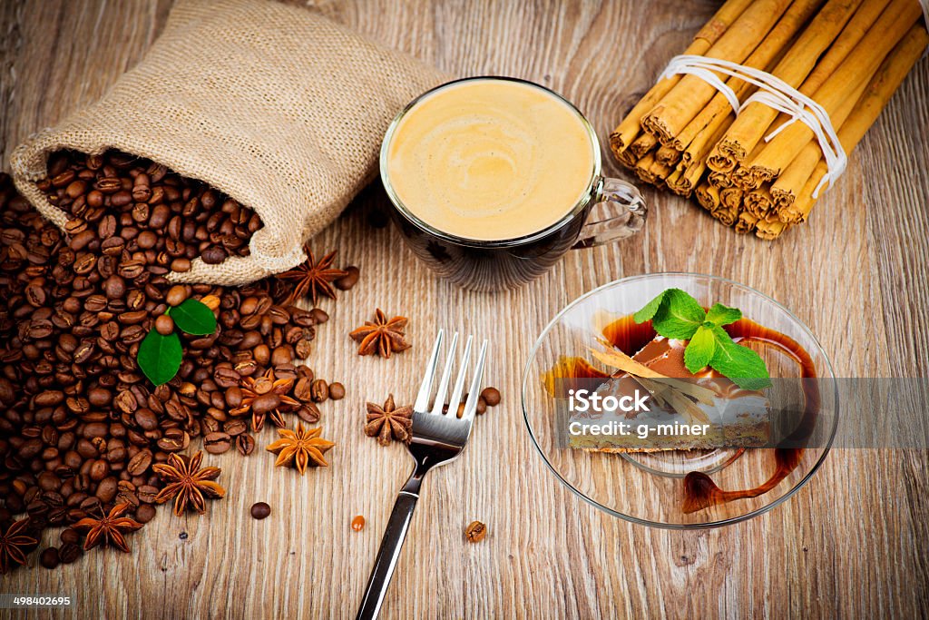 Cup of coffee and a cake Photo of cup of coffee and a cake on the vintage wooden table Backgrounds Stock Photo