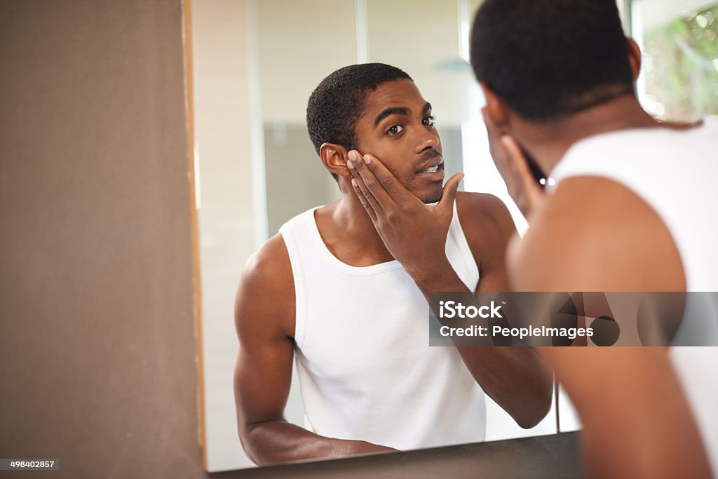 Skincare for today's modern man A young man applying cream to his face while looking in the mirrorhttp://195.154.178.81/DATA/i_collage/pi/shoots/783406.jpg Men Stock Photo