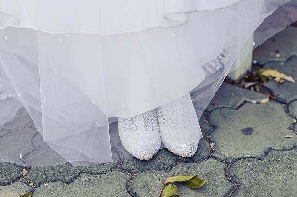 istock white wedding dress and shoes 498403347