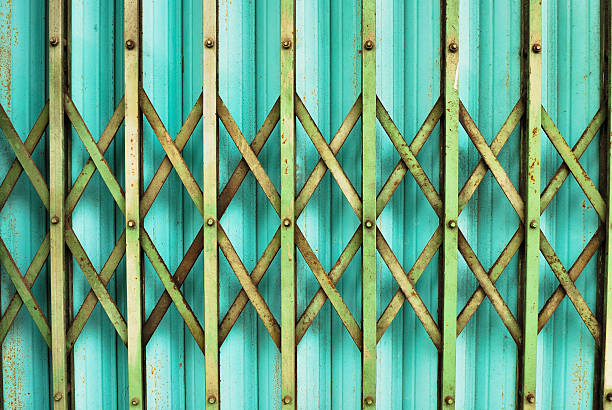 istock Old Metal Folding Door  with rusty and scratches close up 498404395