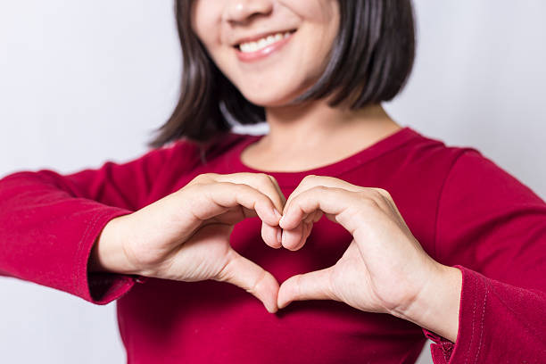 istock Woman show heart hands 498408168