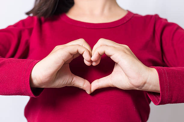 istock Woman show heart hands 498408208