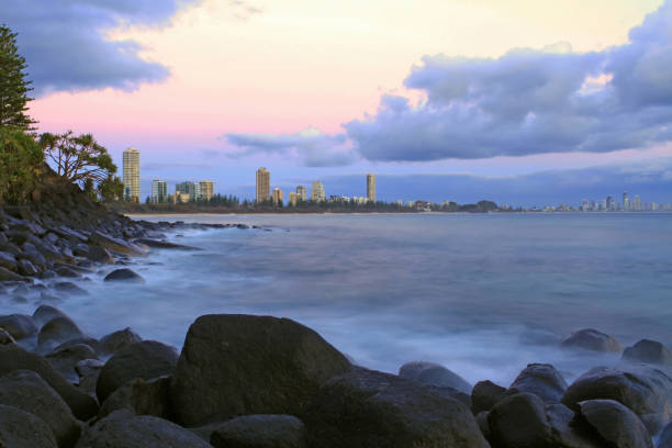 istock Purple Sunrise Rocky Shoreline 498408524
