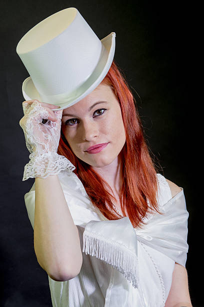 istock Young Adult Female Doffing Her Top Hat 498410020