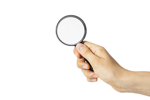 istock Female hand holding the magnifying glass 498421869
