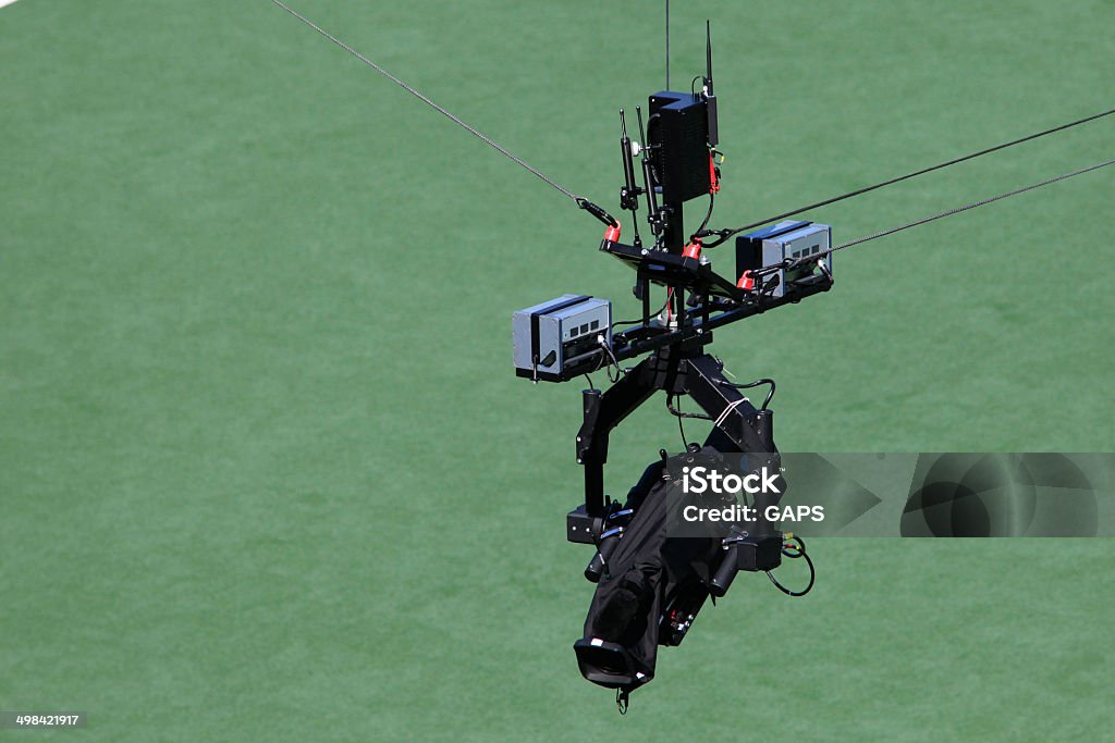 spidercam hanging above a sport field spidercam for making aerials during a match hanging above a sport field Spidercam Stock Photo