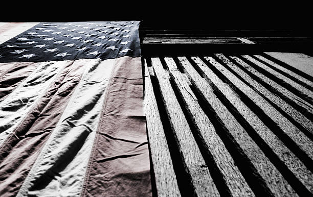 istock USA Flag Hanging on Barn Wall 498422169