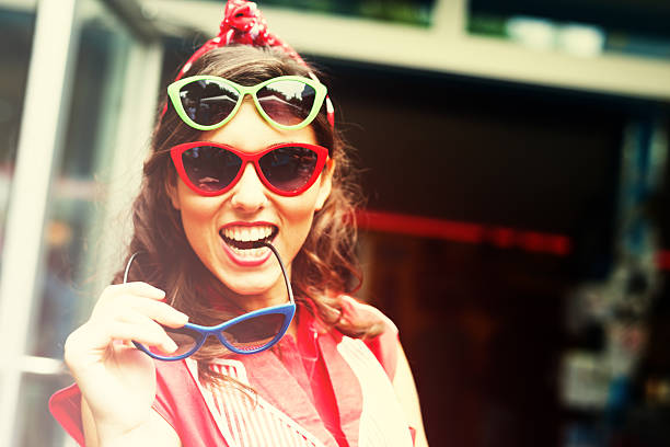 Funny young woman Portrait of funny young woman with three colorful sunglasses. Slective Focus stock pictures, royalty-free photos & images