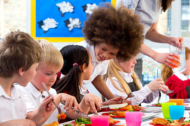 istock Children Eating School Dinners 498424441