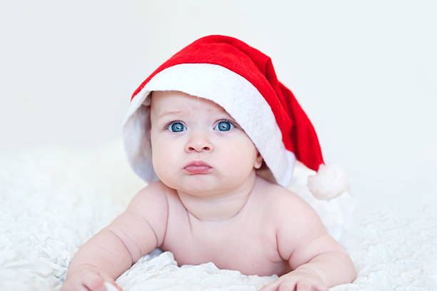 красивые забавные младенца в santa's hat - one little boy child one person little boys стоковые фото и изображения