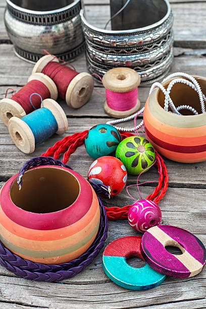 istock beads on wooden background 498424798
