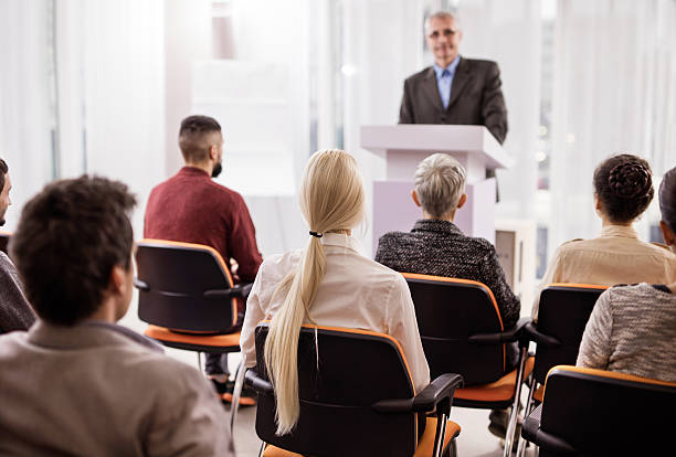 istock Back view of a business people attending a seminar. 498424842
