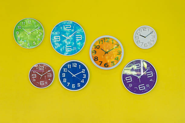 istock watch on yellow wall,pop art color 498424974