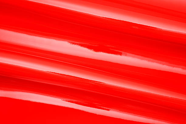 istock Close-up of red shiny vinyl wave texture background. 498425555