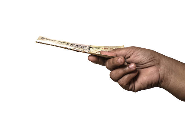 hand holding 500 rupee Indian currency