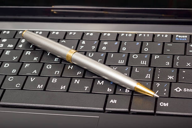 istock Electronic collection - laptop keyboard with pen 498427986
