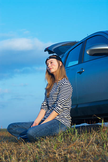 istock Tired Woman With Her Broken Car 498427995