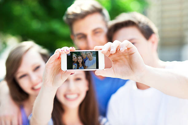 istock Friends taking a selfie with smartphone 498428079