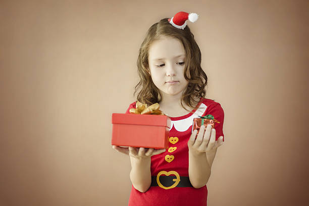 istock dwarf with two christmas gifts 498428302