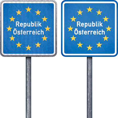 European border traffic signs for Austria. Two blue square road signs with yellow stars and white text mounted on steel frame with one pipe steel post. One traffic sign is retroreflective and the other standard. Photorealistic vector illustration isolated on white. Layered EPS10 file with transparencies and global colors. Individual elements and textures. Related images linked below. http://i161.photobucket.com/albums/t234/lolon5/Bordercrossing_zps6898bae7.jpg 