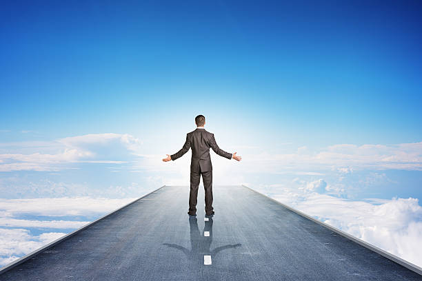 istock Businessman on road in sky 498433170