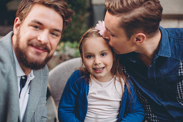 istock Gay Parents with daughter 498433776