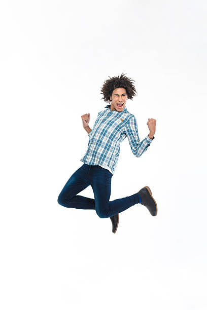 istock Cheerful afro american man jumping 498436064